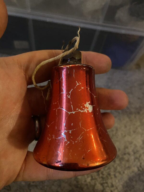 A red bell wearing its history
