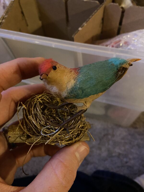 A cotton bird on its nest